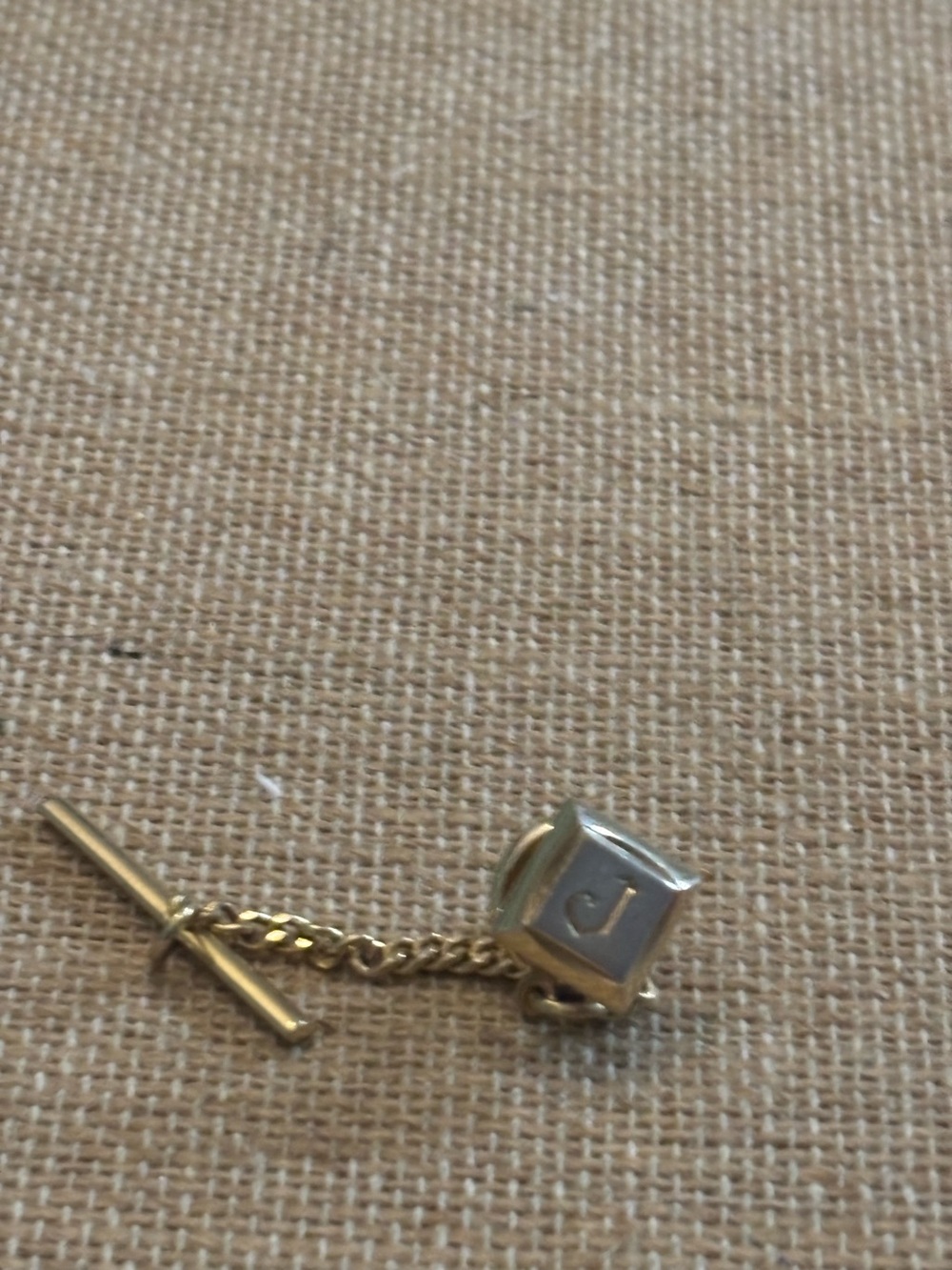 Monogrammed “J” pin lapel